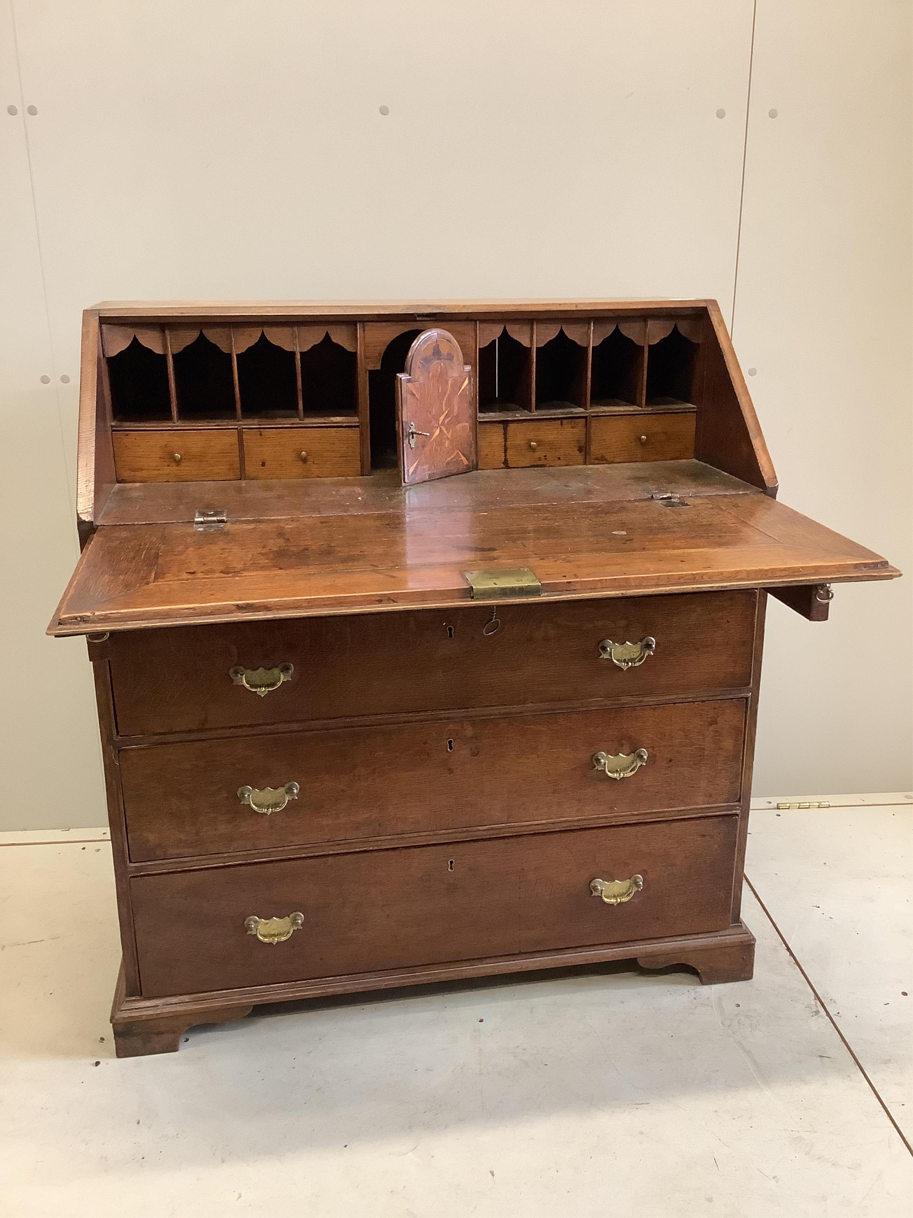 An 18th century parquetry inlaid oak bureau, width 93cm, depth 49cm, height 102cm. Condition - fair